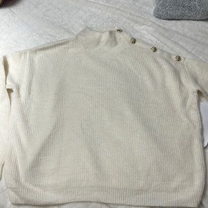 Size small turtle neck sweater with studs.